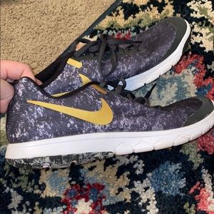 Black and gold Nike shoes
